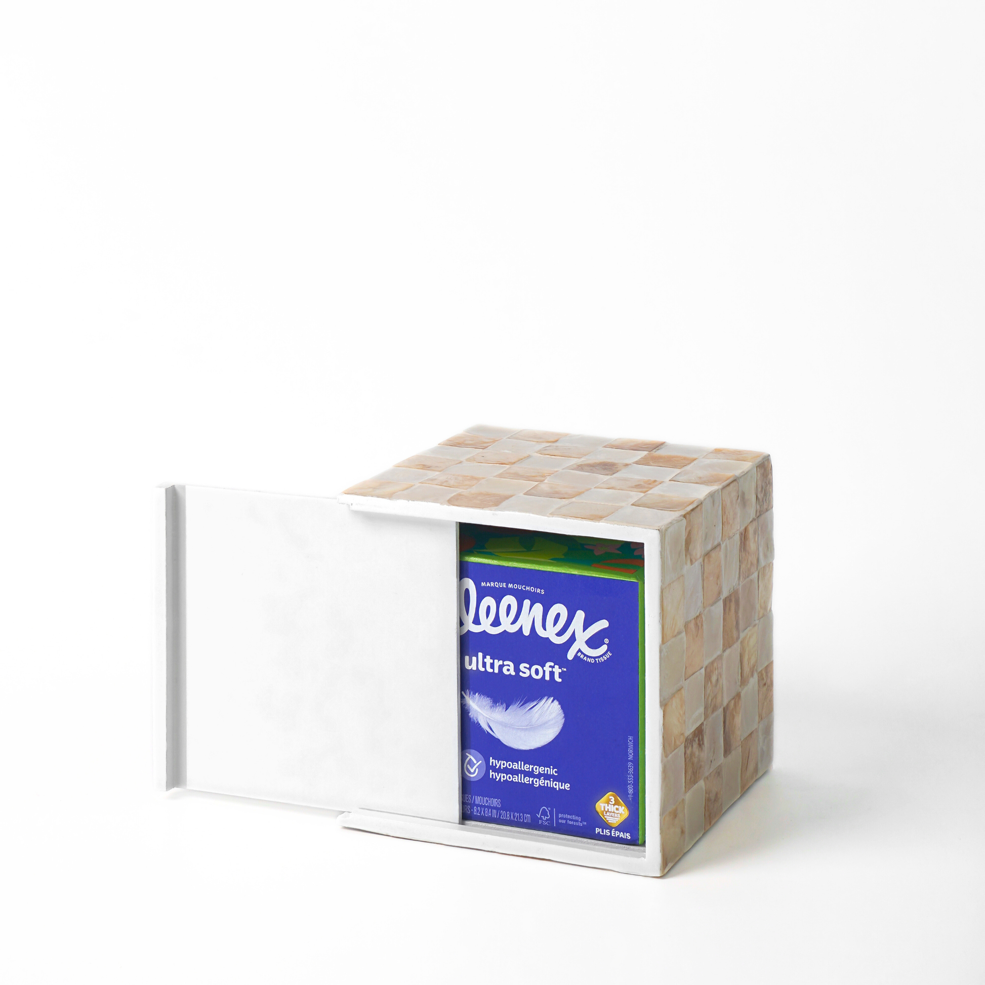 A capiz shells tissue cover box with front panel and a beige and ivory checkerboard patterned side, holding a blue 60-count Keenex Ultra Soft tissue box.